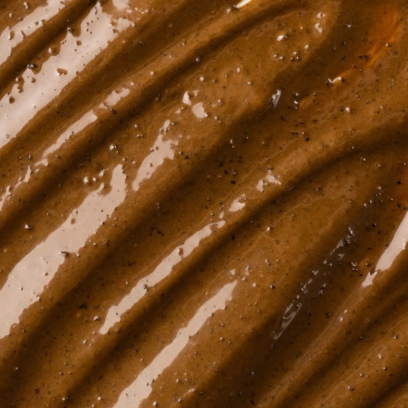 BonCrem crunchy coffee cream in close view, with ground coffee visible through the surface.