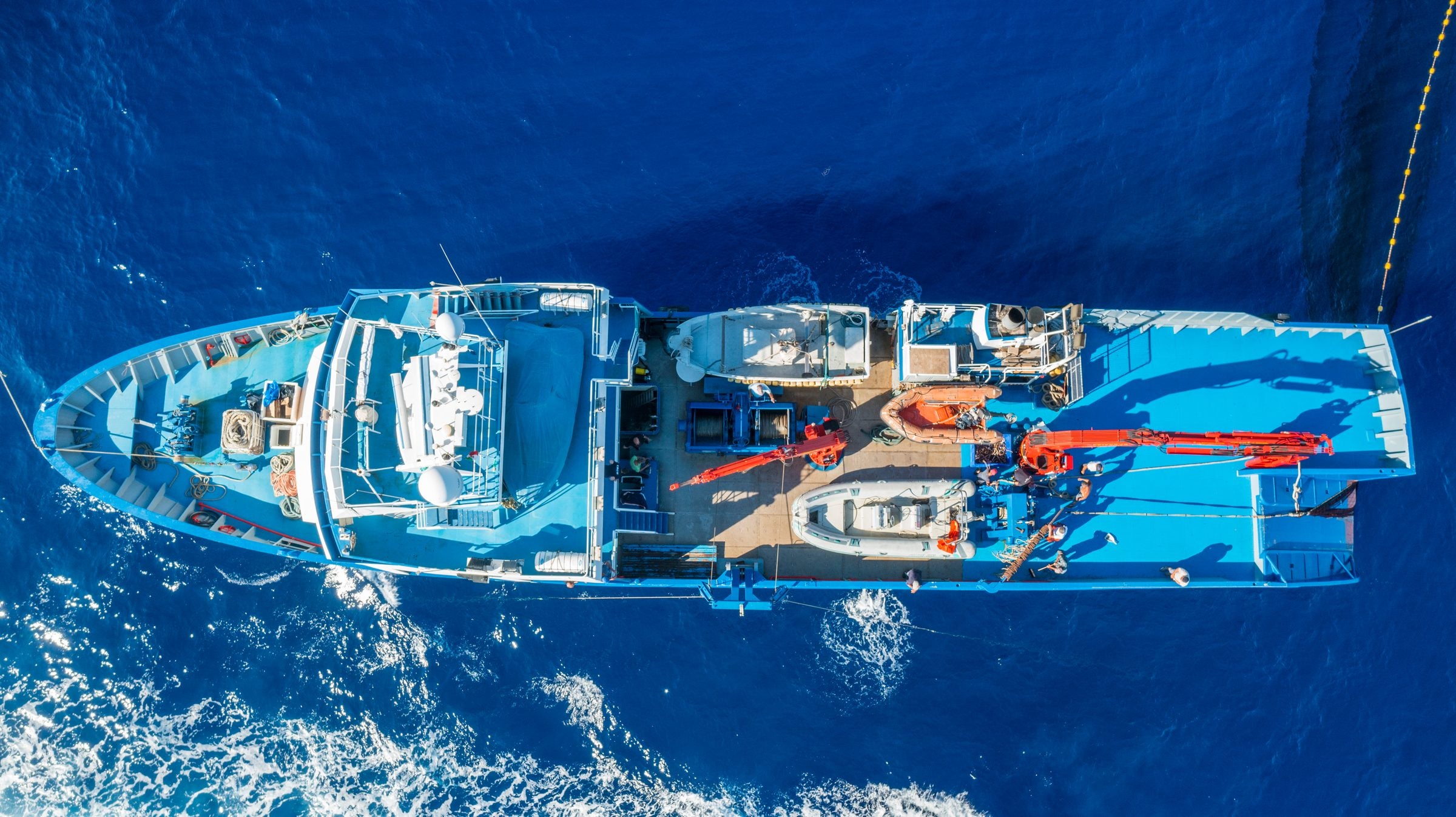 Top-down aerial view of the 42-metre steel vessel Atlante, built by the Testa family in 2002, underway on open sea
