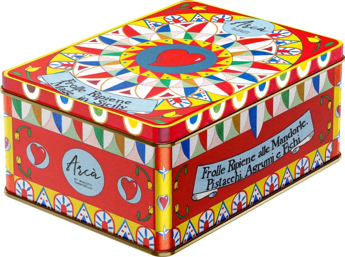 A red tin painted with folk patterns, a red heart at the centre of a star on the lid